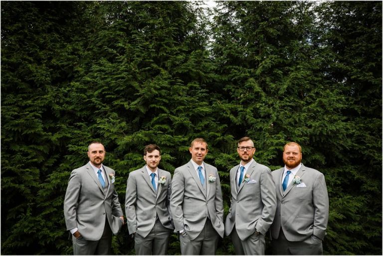 Groomsmen and Groom pose for a photo taken by Abbie Holmes Estate Wedding Photographer