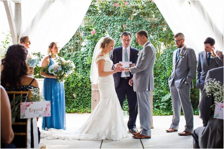 Bride and groom exchange vowels during wedding ceremony at Abble Holmes Estate wedding 