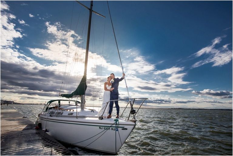 Ocean City Yacht Club Wedding couple on sailboat with great view