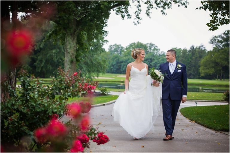 Candid of bride and groom walking at their Atlantic City Country Club Wedding