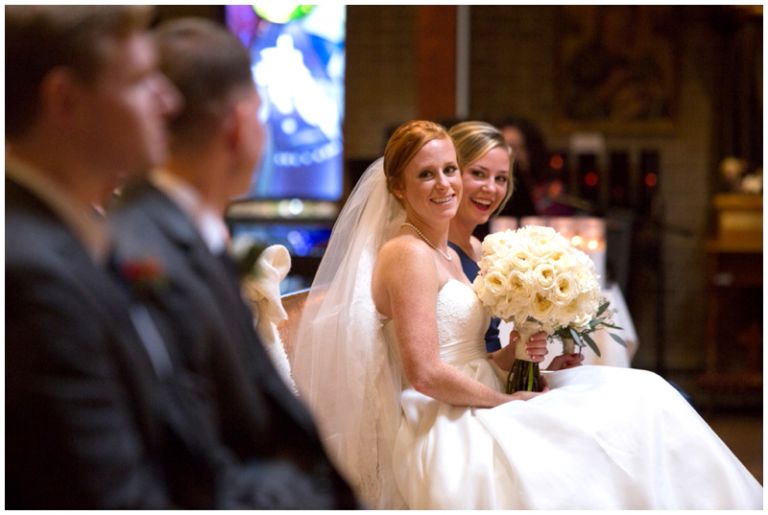 NJ wedding photographer captures bride looking at groom during catholic ceremony