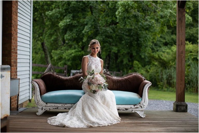 Beautiful photo of bride sitting on porch at Everly at Railroad in NJ