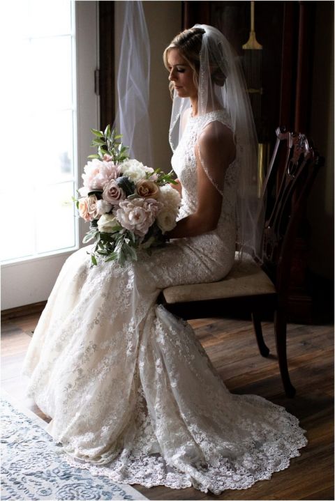 Gorgeous bride holding bouquet from Primrose