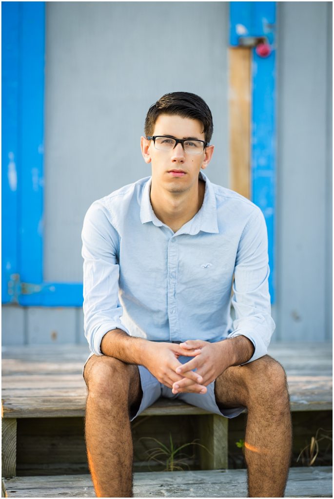 senior picture of young man on bench
