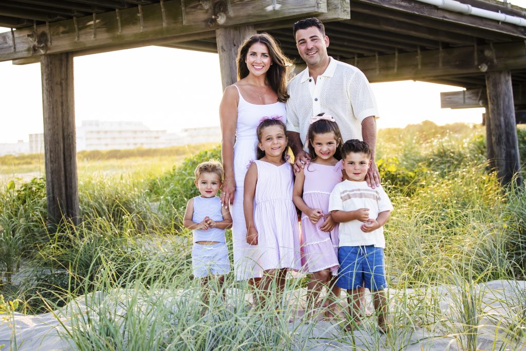 family photo shoot under a pier
