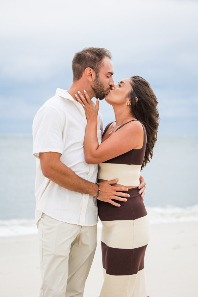 couple kissing after engagement