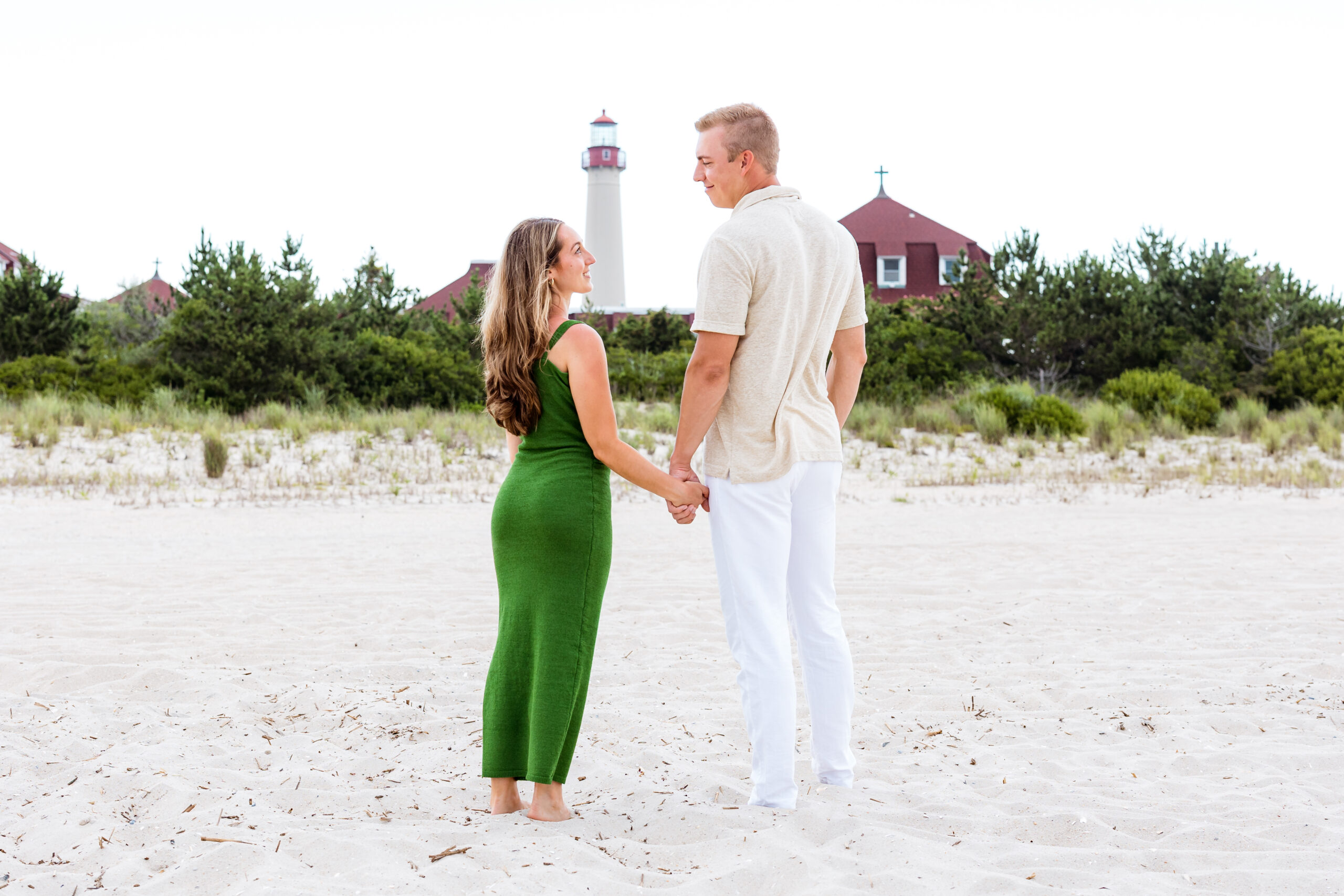 cape may, nj proposal session with lighthouse in background